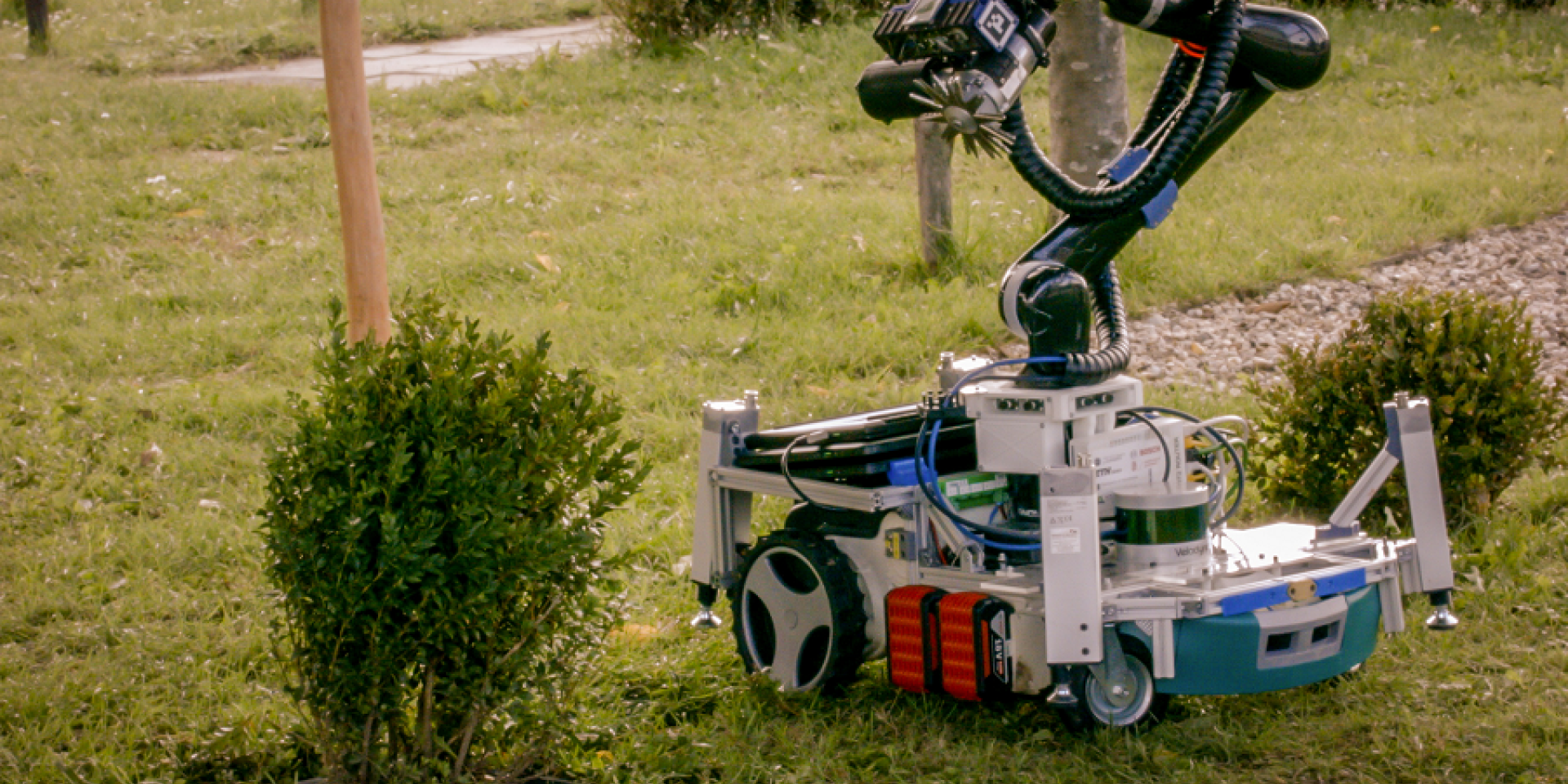 Trimbot robot trimming a bush