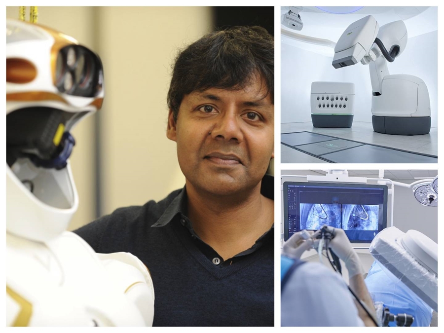Photo of Sethu Vijayakumar stood next to a humanoid robot.
