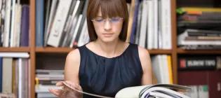 Female student reading a book