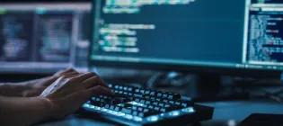 Human hands on computer keyboard