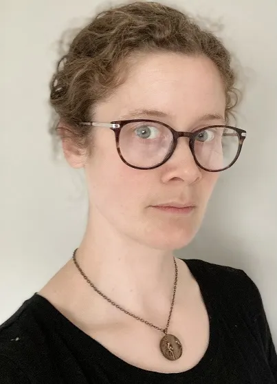 Portrait photo of a woman wearing glasses