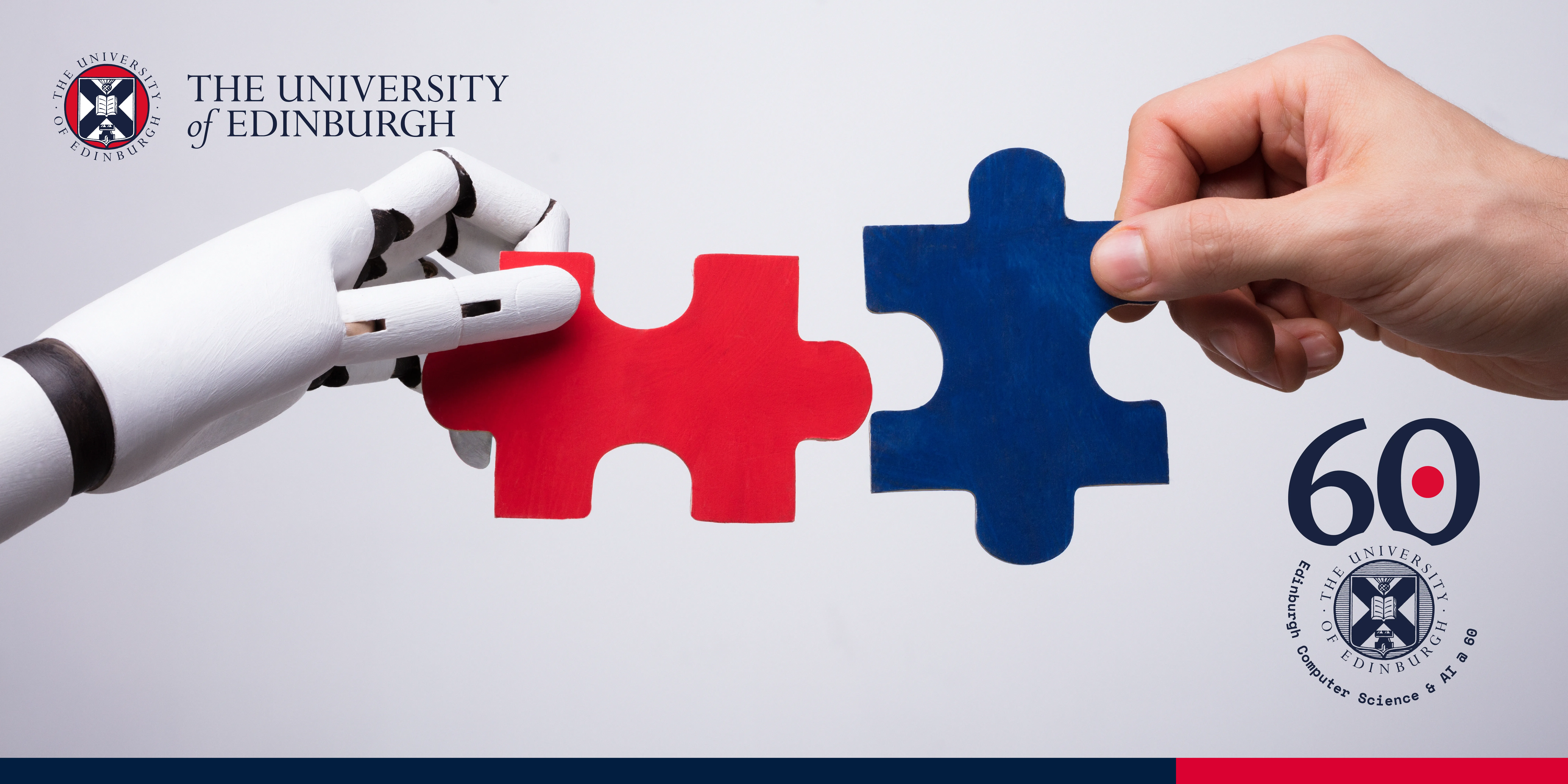 Two hands: a robotic one and a human one, holding two fitting puzzles - blue and red.