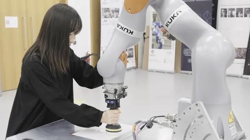 Human demonstrating motion to robot