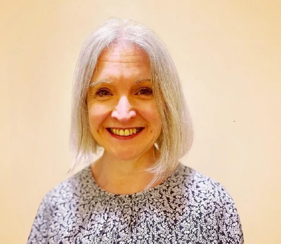 photo of a smiling grey-haired woman