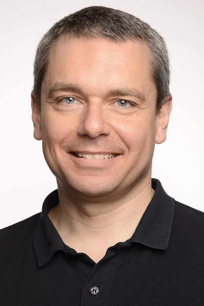 Photo of a middle aged man smiling