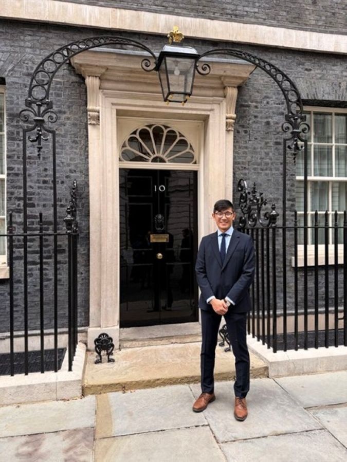 Bryan Li stands outside 10 Downing Street