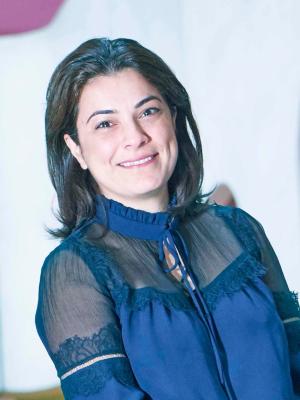 Photo of Elham Kashefi wearing a dark blue blouse with mesh panelling.