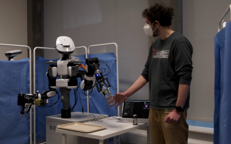 AvatarX robot handover task Nexi handing over a water bottle during a remote operation trial